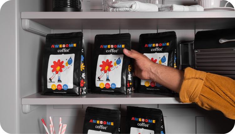 A person picking out awesome coffee bags from a shelf